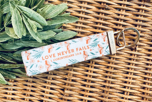 Love Never Fails Wristlet Keychain