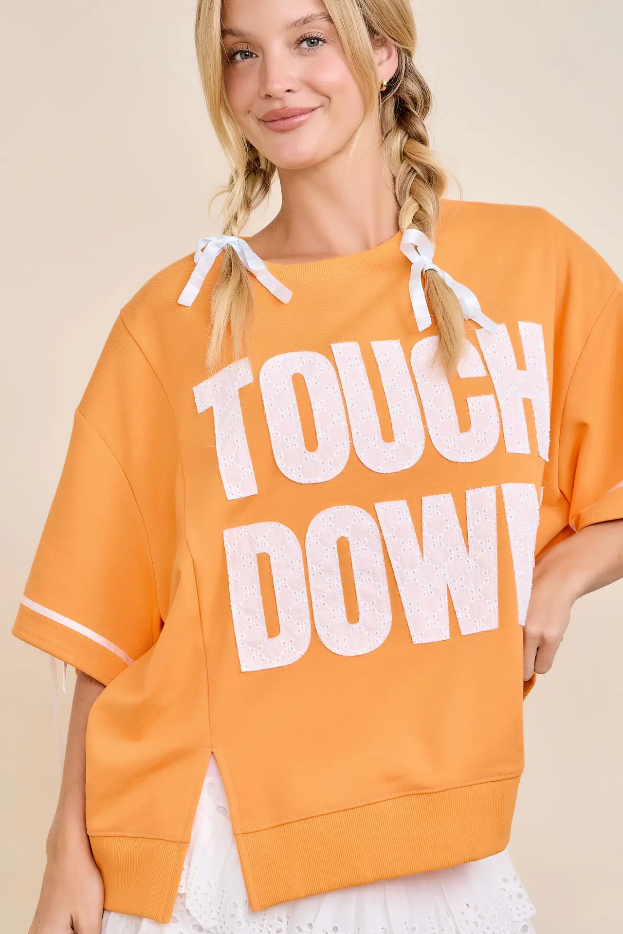 Touchdown Eyelet Appliqué Pullover Top